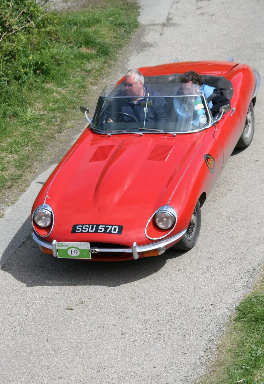 Photographic greetings card of a bright red Jaguar 'E' type roadster.