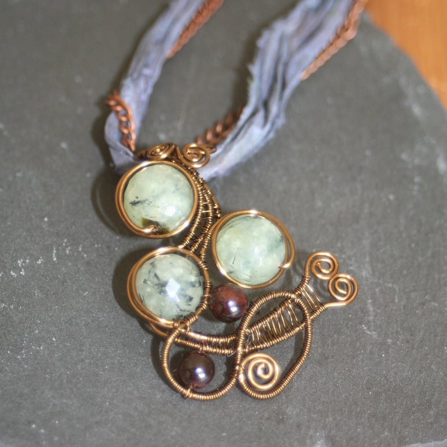 Prehnite and garnet wire wrapped pendant and sari ribbon necklace