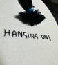 Embroidery hoop with motivational quote of a girl “hanging on” upside down  - Image 6