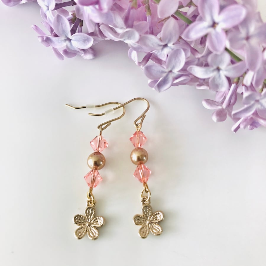 Pink glass and gold dangle earrings 