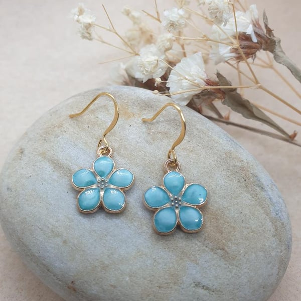 18k gold plated earrings with gold plated flowers with pearlised blue enamel 