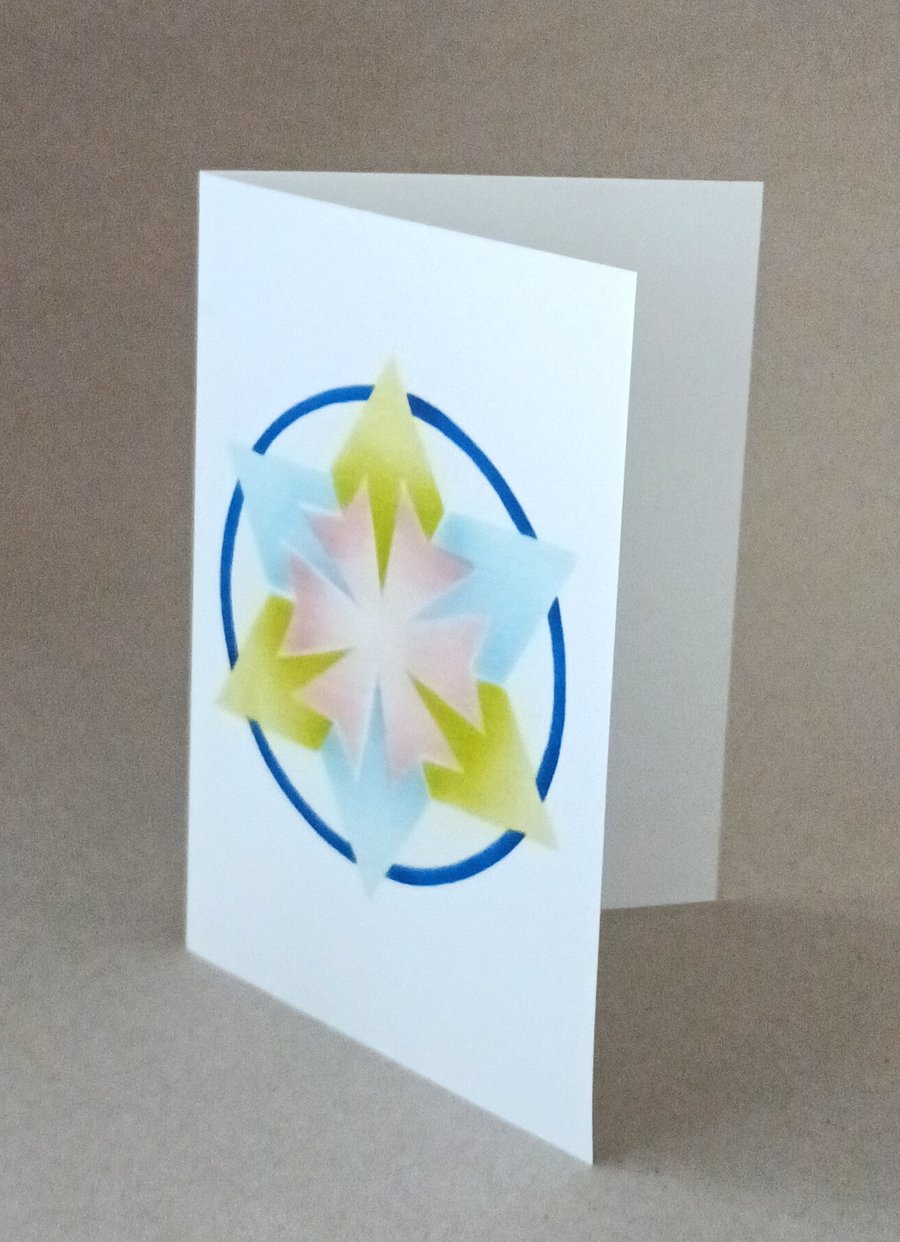 Star Mandala card, a blue and yellow green 6 pointed star on a blank inside card
