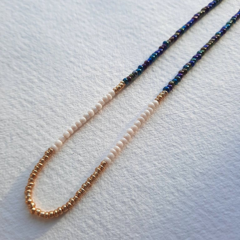 Glass beaded necklace, iridescent blue, gold, cream, 16 to 18 inches