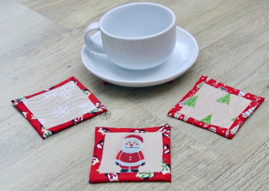 Set of Four Quilted Christmas Coasters with Santa, Snowmen, Trees and Snowflakes