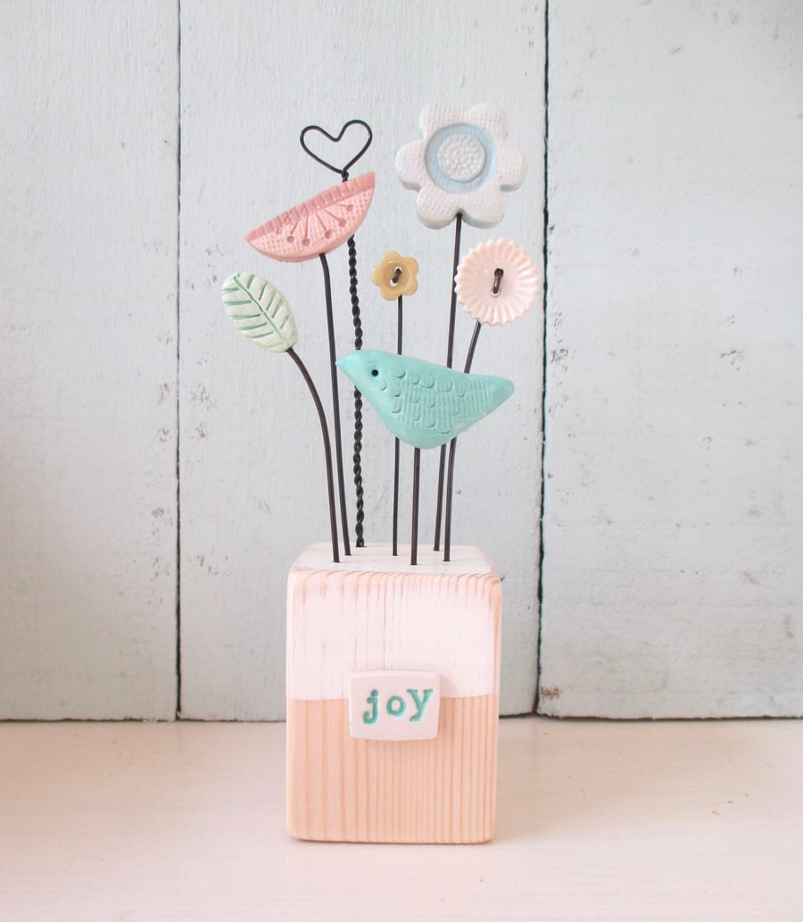 SALE - Clay flowers and bird sculpture 'joy'