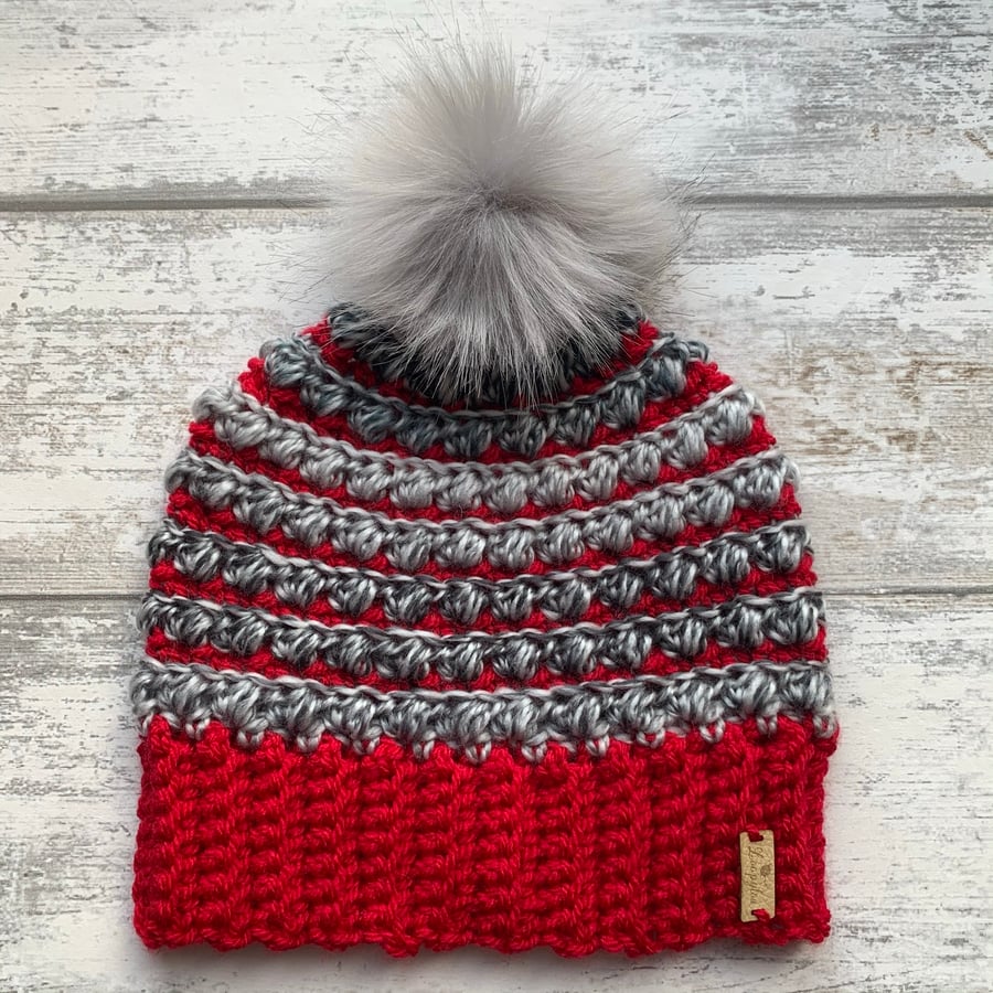 Handmade red and grey crochet beanie hat with grey faux fur pompom