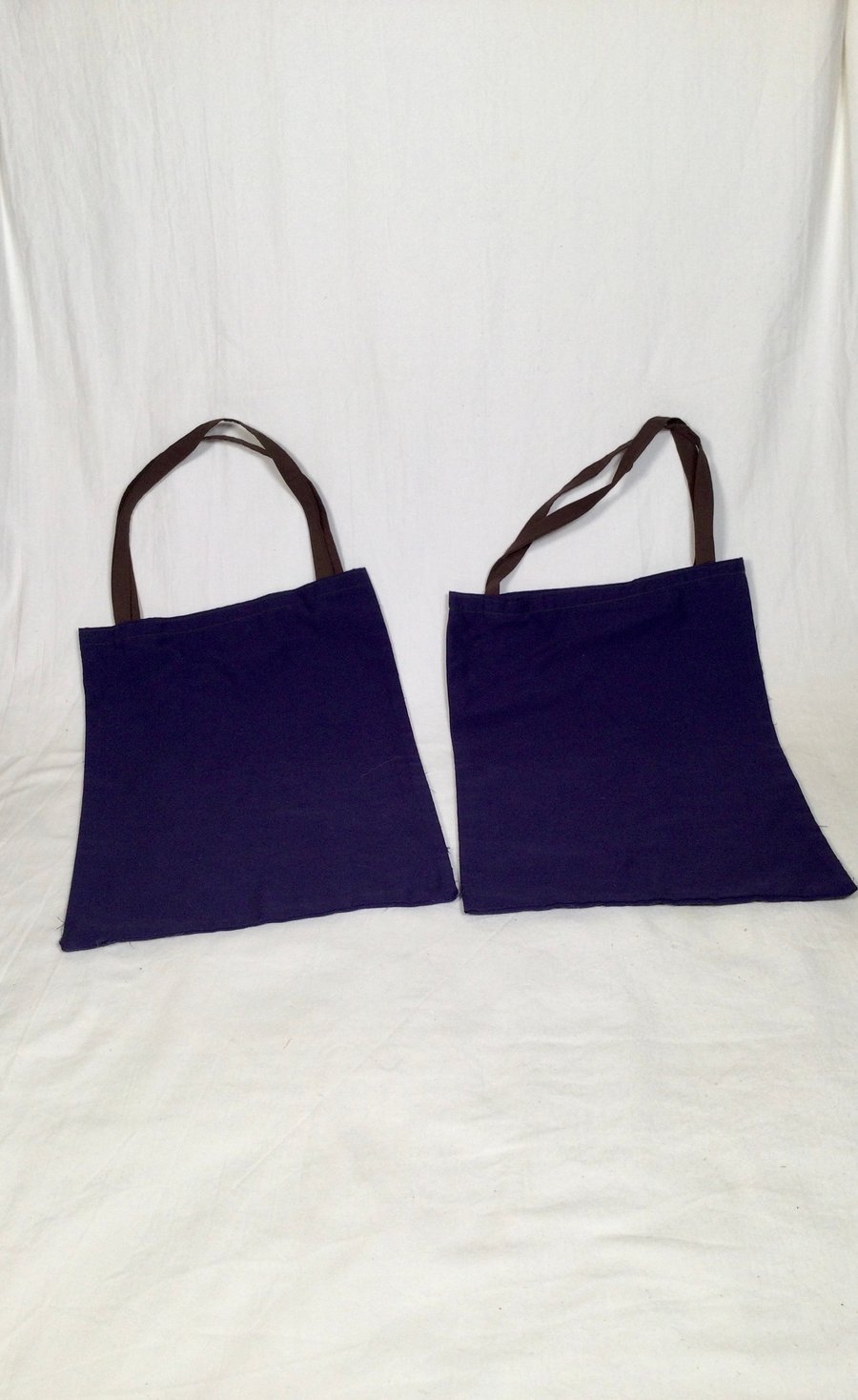 Coloured, reusable, recycled cotton fruit and vegetable shopping bags.
