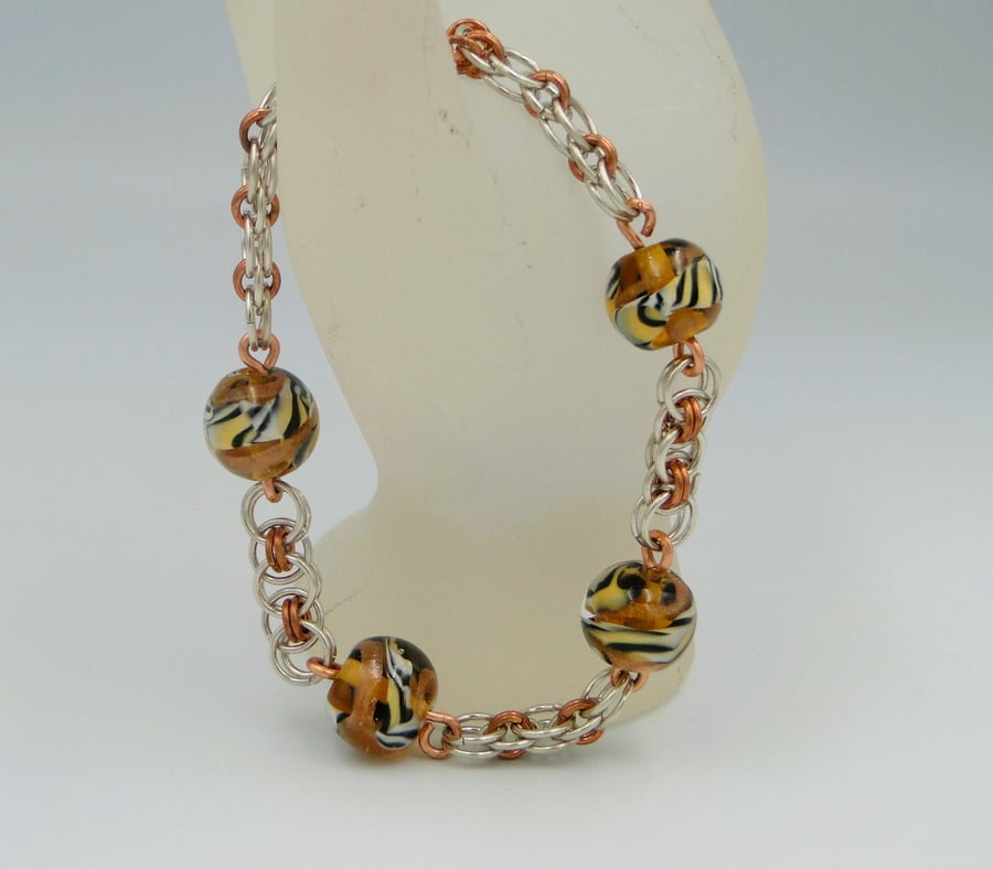  Copper and silver chainmaille bracelet     Tiger stripped handmade focal beads