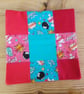 Cushion cover in a blue and red cartoon theme with envelope closure.