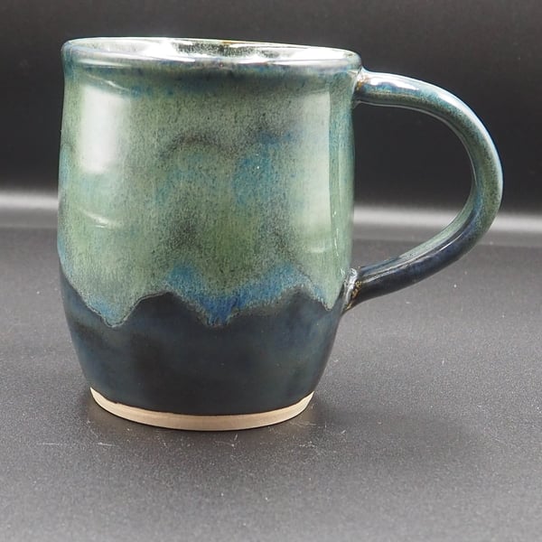 Large stoneware pottery mug finished in a multi-coloured green and blue glaze