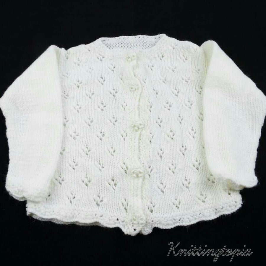 Hand knitted baby cardigan in white to fit 12 months