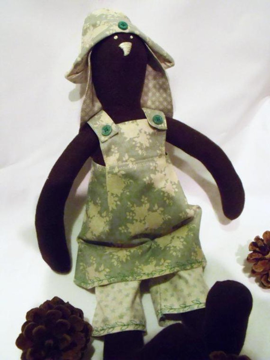 Tilda style brown bunny rabbit doll for display, green floral outfit