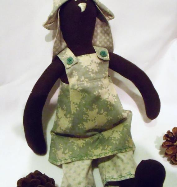 Tilda style brown bunny rabbit doll for display, green floral outfit