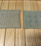 Set of four beige linen coasters with sashiko embroidery detail - Image 2