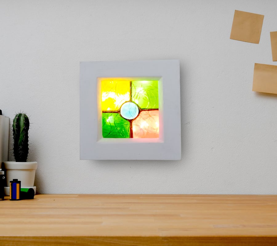 Illuminated stained glass wall art- nightlight has 6 hour timer.  Soft Ambient.