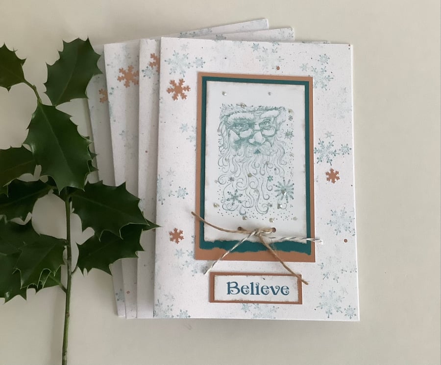  CHRISTMAS CARDS,( pack of 4, large ) Copper and teal . ' Believe '. Santa. 