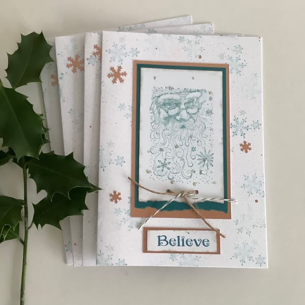  CHRISTMAS CARDS,( pack of 4, large ) Copper and teal . ' Believe '. Santa. 