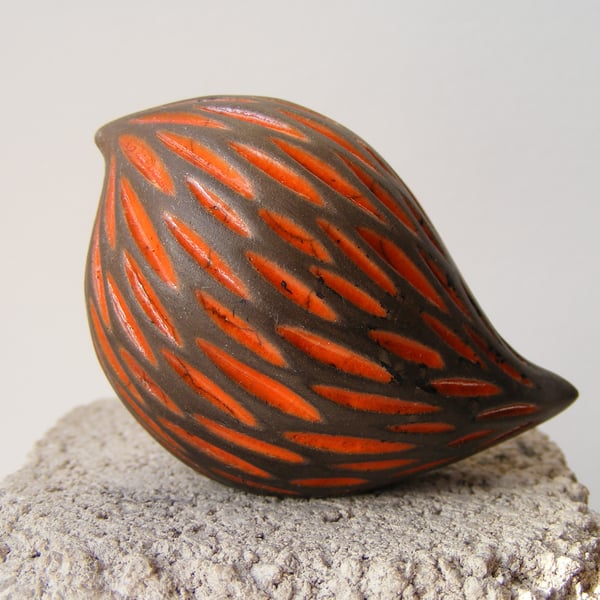 Orange, carved raku baby bird