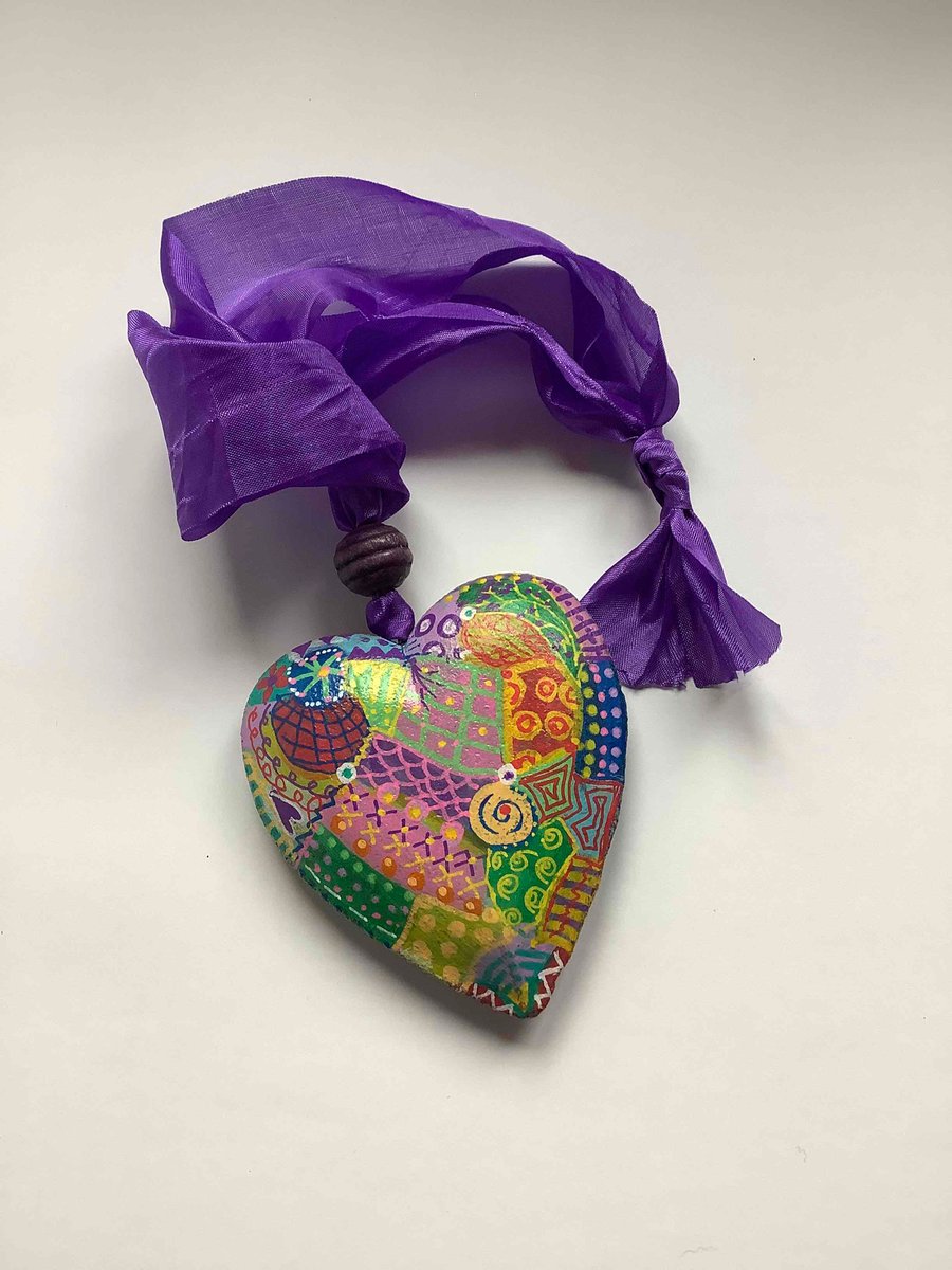 Multi coloured abstract wooden heart