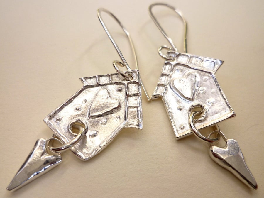 Bird house earrings.