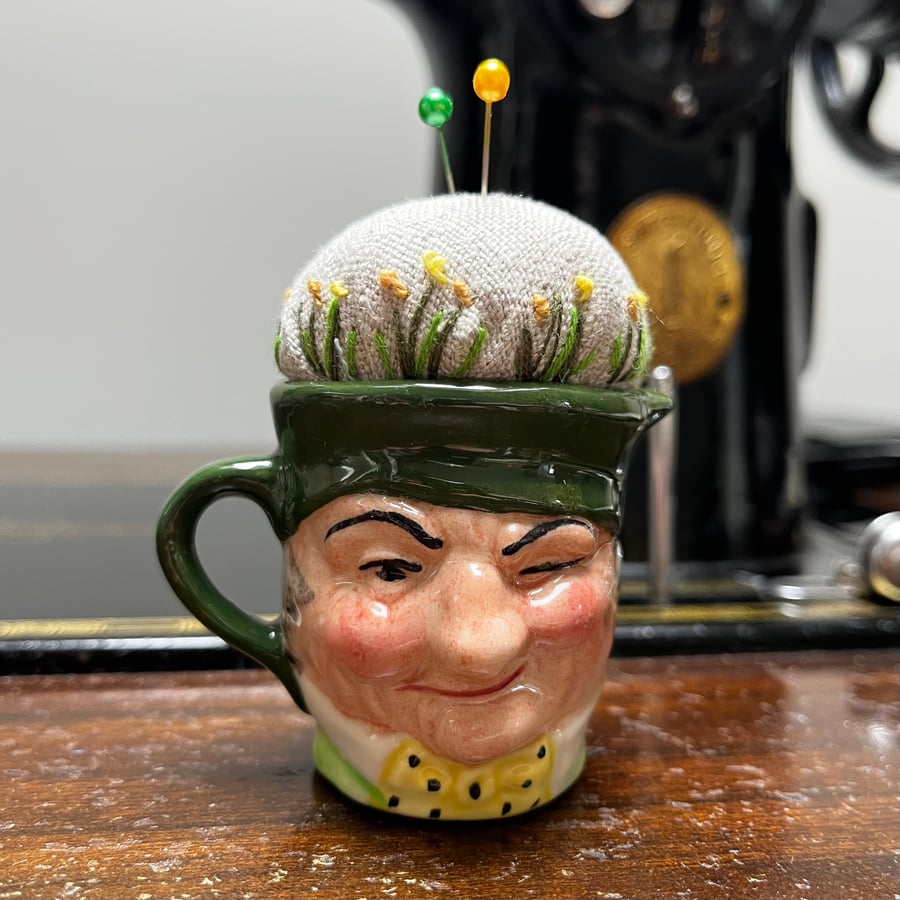 Pin cushion in repurposed vintage Toby jug embroidered flowers and bee