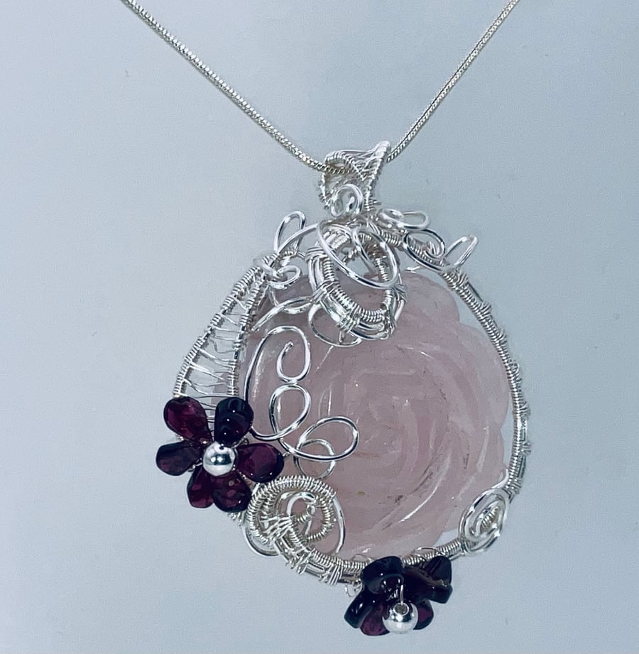 Dreamy rose quartz carved rose pendant in silver with garnet flowers
