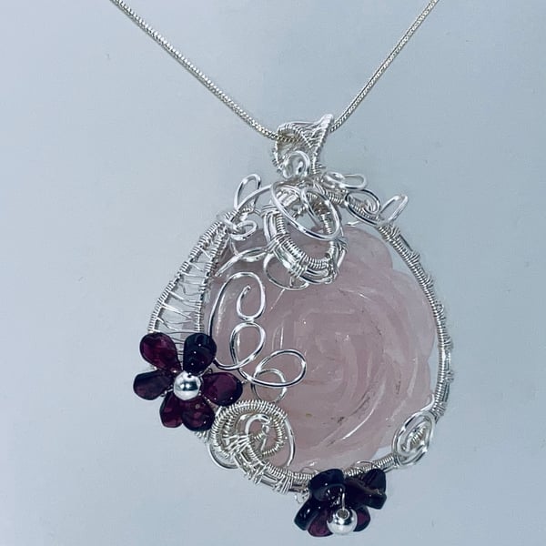 Dreamy rose quartz carved rose pendant in silver with garnet flowers