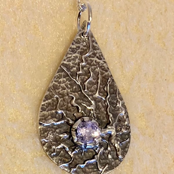 Silver teardrop with crystal and organic textures