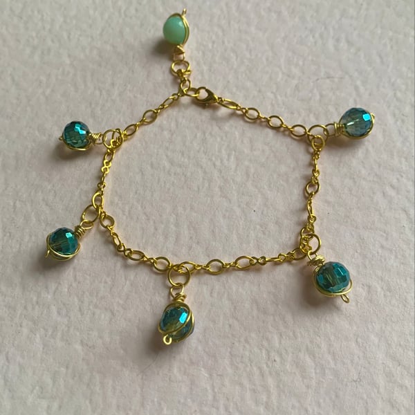 Crystal bracelet.  Green crystals and an amazonite bead on a gold chain. Unique.