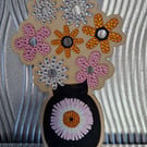 Free standing wooden decoration, flowers in a vase. 