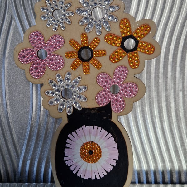 Free standing wooden decoration, flowers in a vase. 