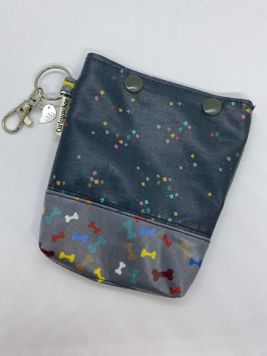 Dog poo bag and treat holder.