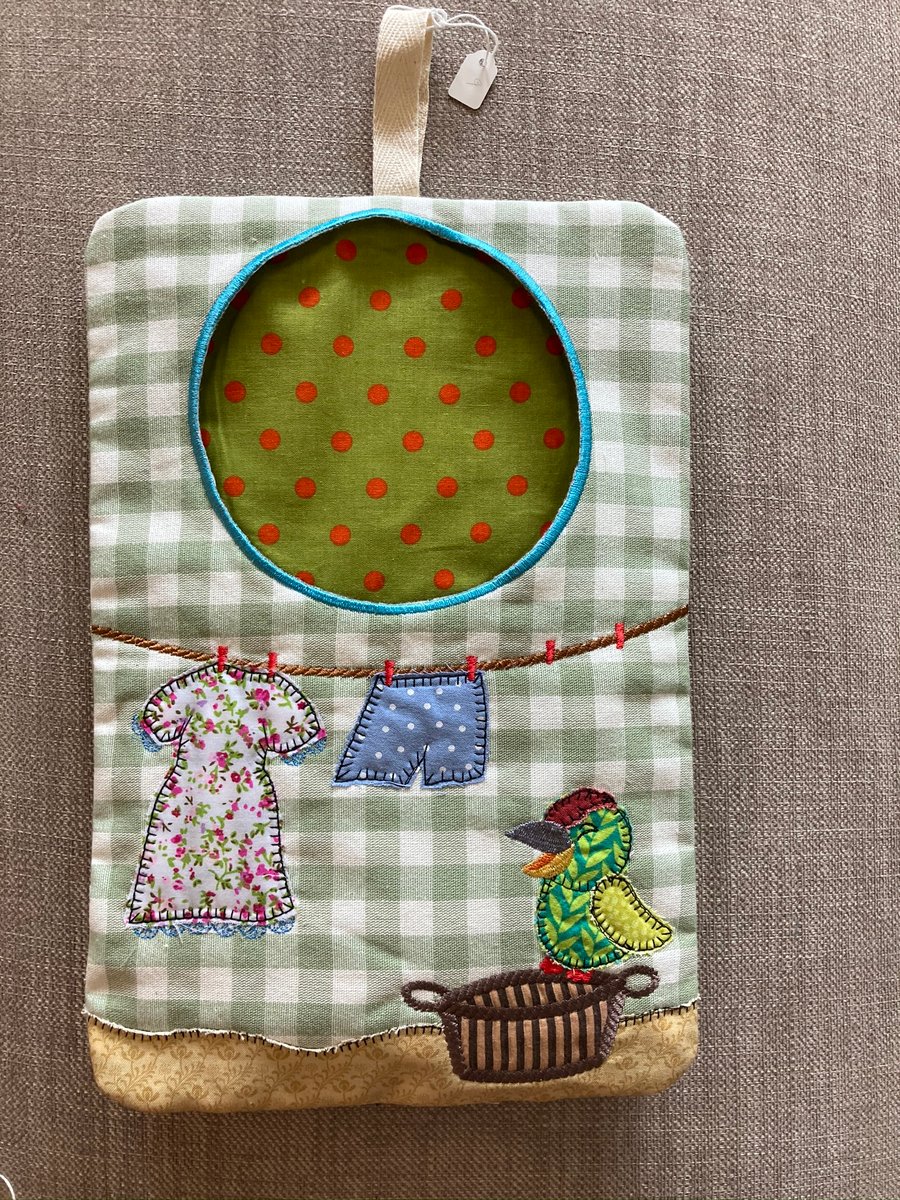 Embroidered fabric peg bag. 