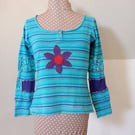 Striped patchwork top with long sleeves and flower applique
