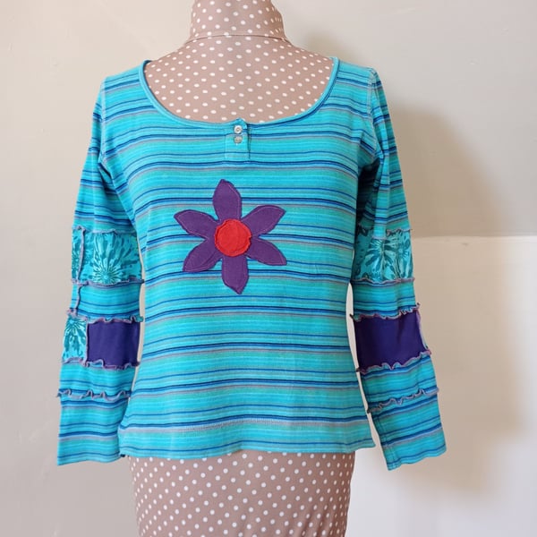 Striped patchwork top with long sleeves and flower applique