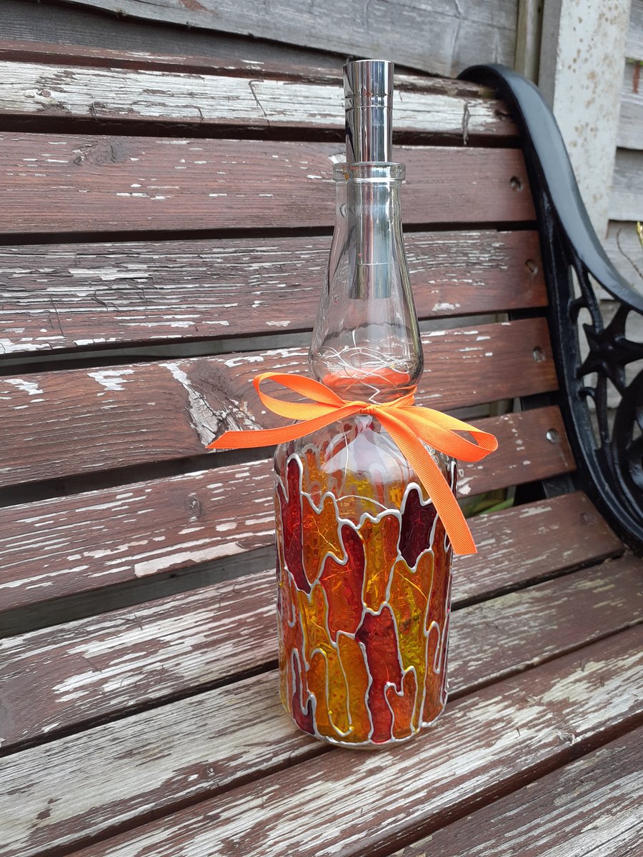 bottle lamp up-cycled in orange, red, yellow