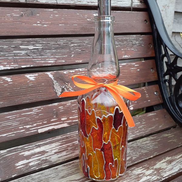 bottle lamp up-cycled in orange, red, yellow