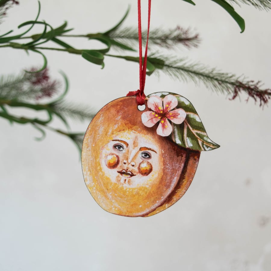 Peachy Pete, the peach wooden hanging decoration.
