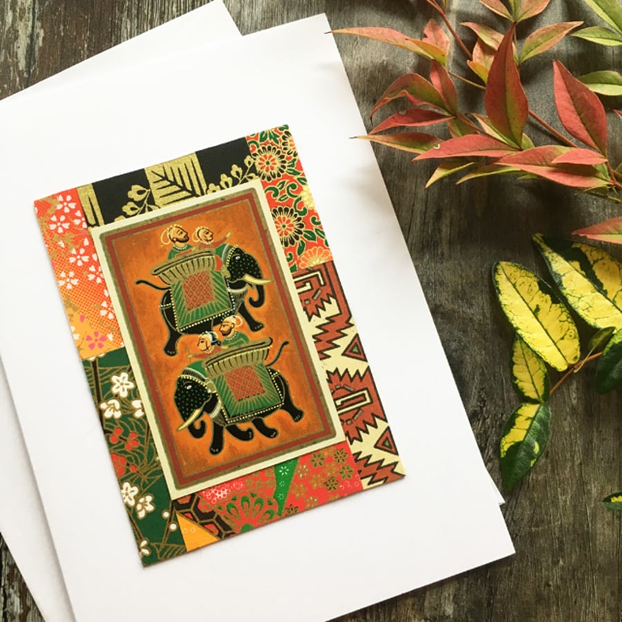Handmade card. Collage: Elephants on orange