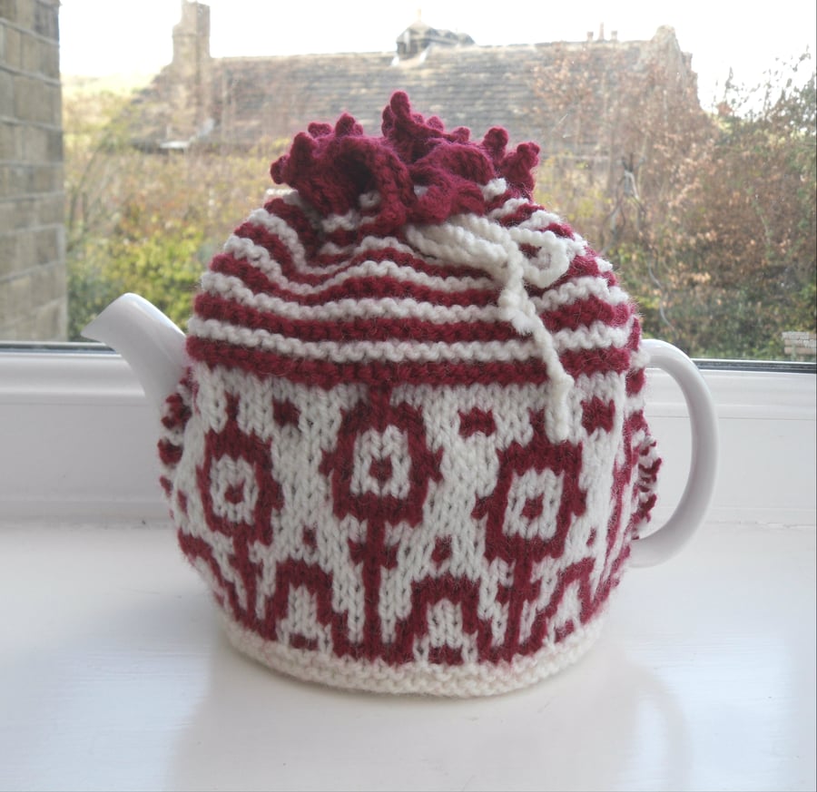 Funky flowery hand knit tea cosy in red and white