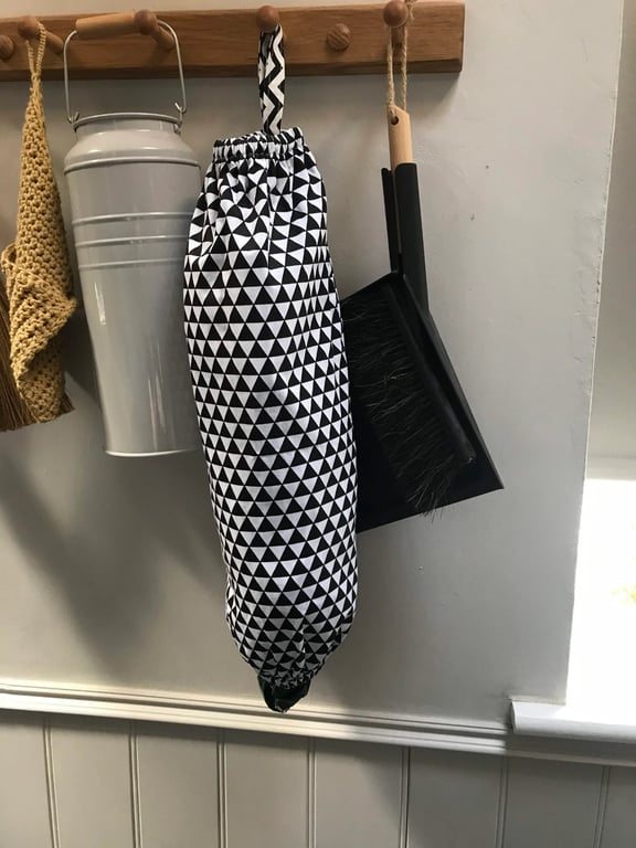 Hanging plastic bag holder or dispenser.
