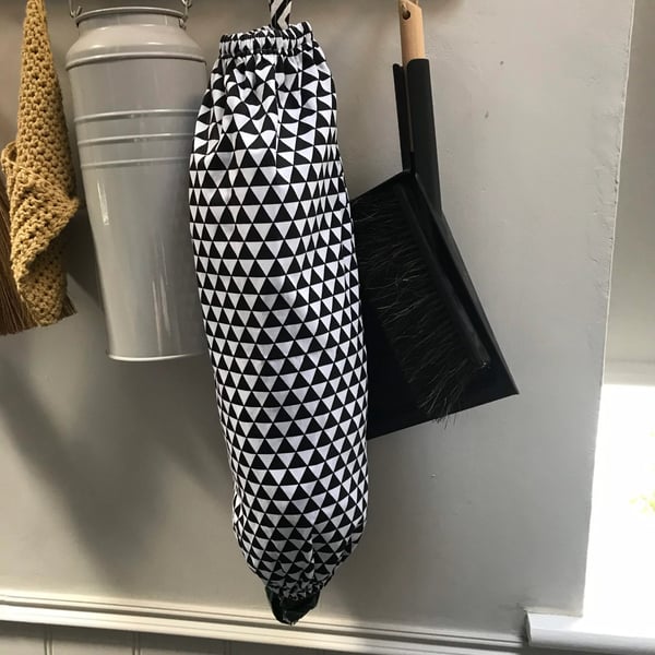 Hanging plastic bag holder or dispenser.