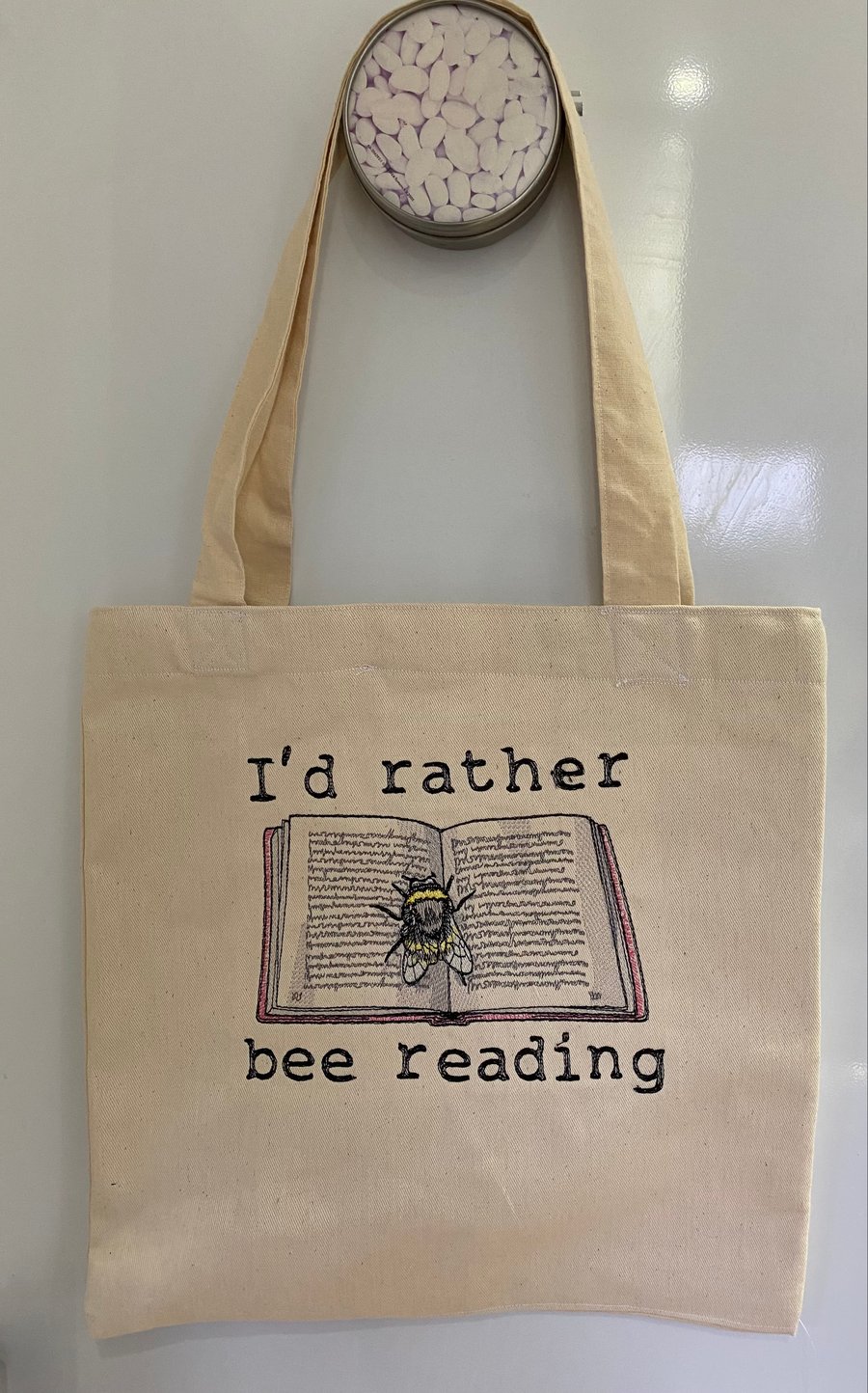 Tote Bag with embroidered bee and book design 