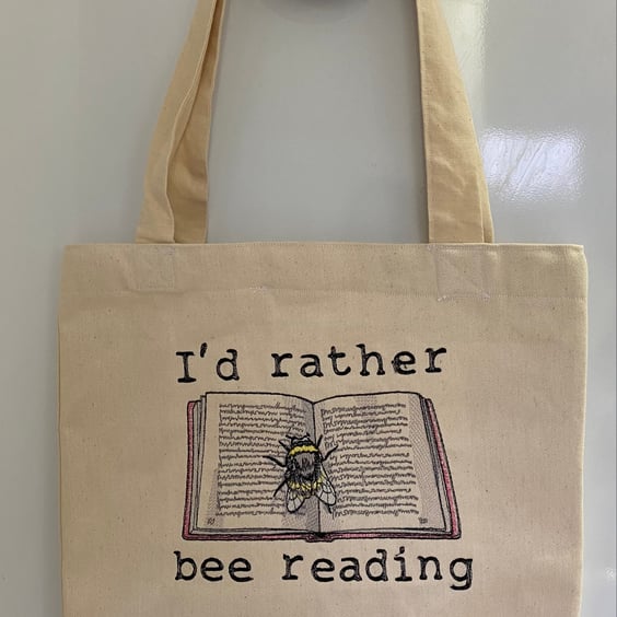 Tote Bag with embroidered bee and book design 