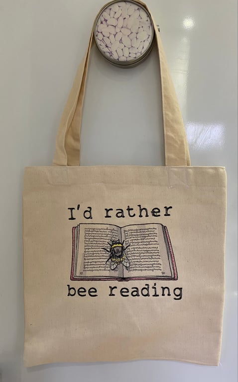 Tote Bag with embroidered bee and book design 