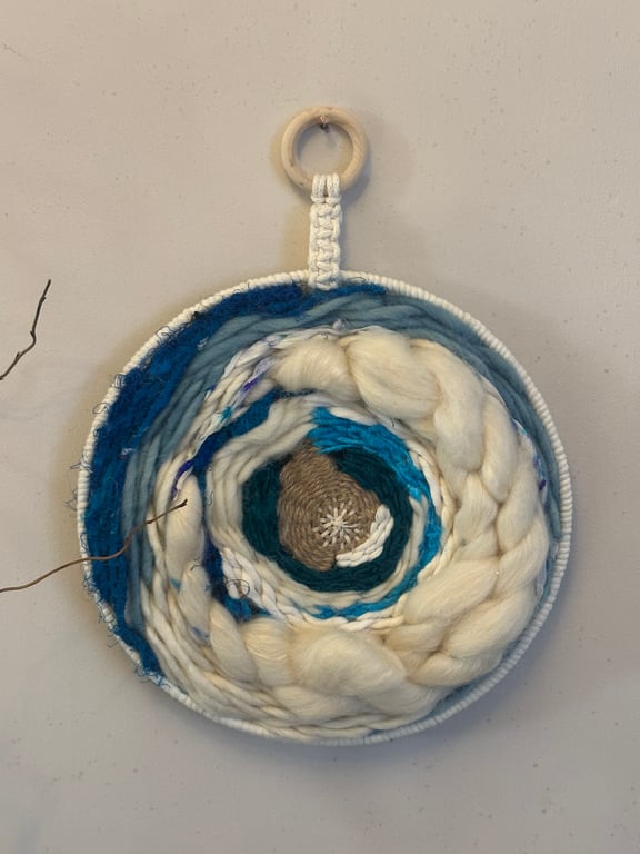 Blue and white circular wall hanging 