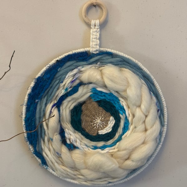 Blue and white circular wall hanging 