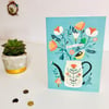 'Folky Can & Bird' - Greetings Card