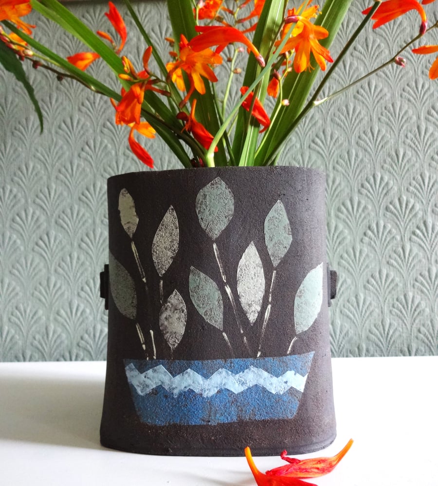 Ceramic potted plant container or vase.  Modern abstract leaf design, handmade.