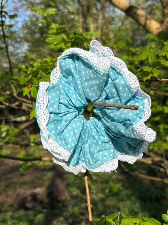 Pretty blue and white spotty scrunchie with lace trim.
